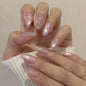 Set of 24 glossy red cat's eye press on nails by Blushimmer, almond-shaped false nails with nude color and detachable charms.