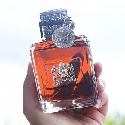 Blushimmer Charm Unleashed Cologne for men with woody, citrus, and vitality notes, featuring a wild, glamourous scent.