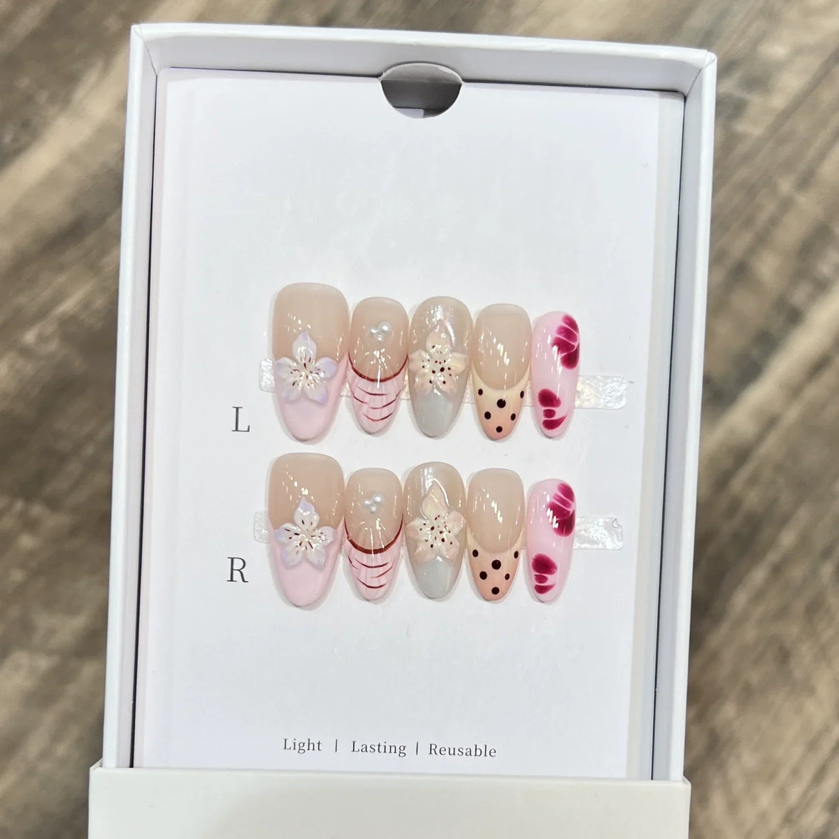 Set of 10 French almond press-on nails with floral design by Blushimmer, wearable faux nails for easy, stylish manicures.