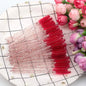 Set of 50 eyelash and eyebrow brushes by Blushimmer, including mascara wands, spoolers, and false eyelash extension tools.