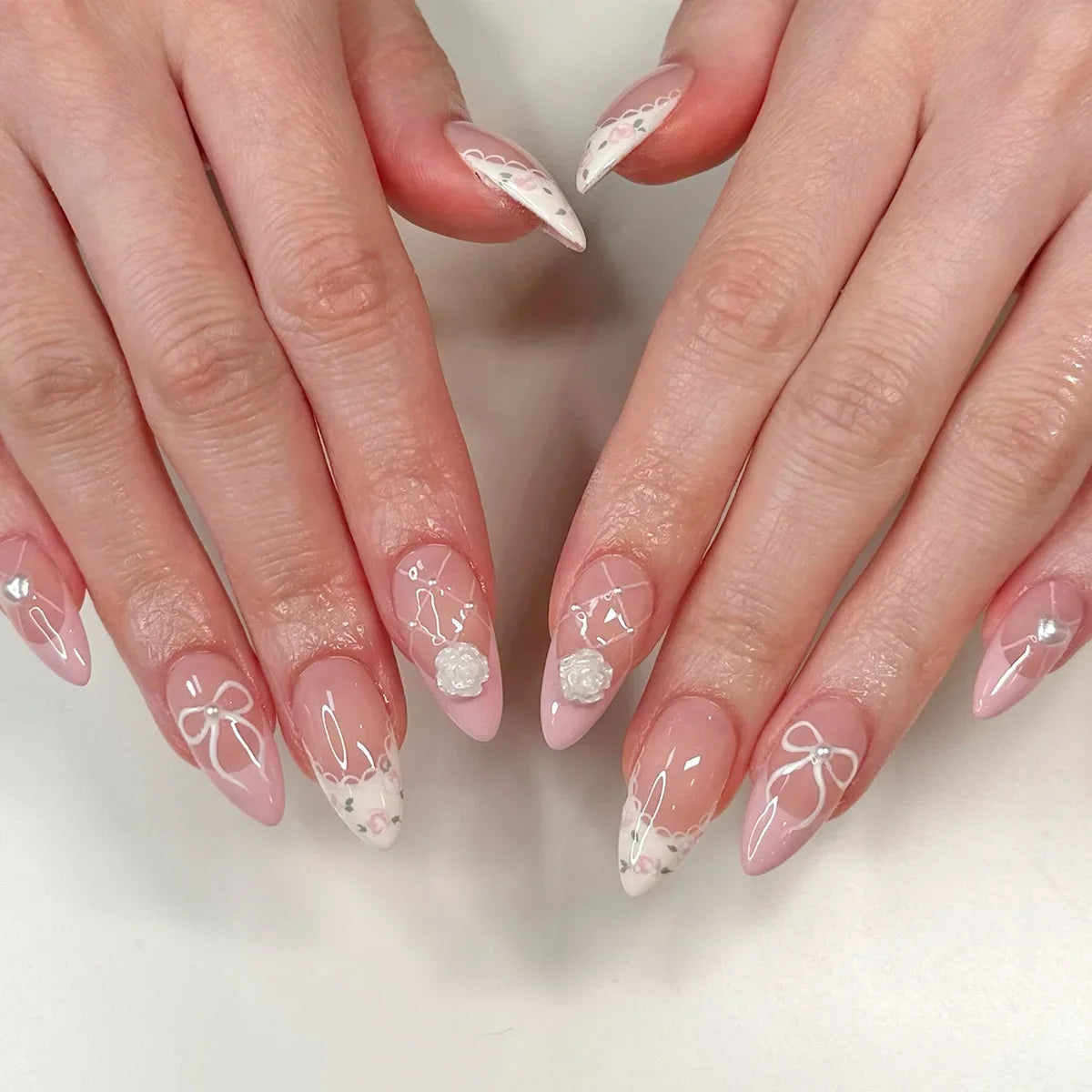 Set of 24 Blushimmer wine red almond press-on nails with cartoon rabbit, bowknot, plaid, pearl accents, and French tip designs.