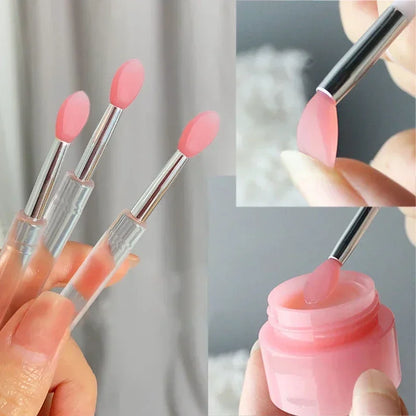 Blushimmer silicone lip and eyeshadow brush with cover, dustproof and portable for precise makeup application.