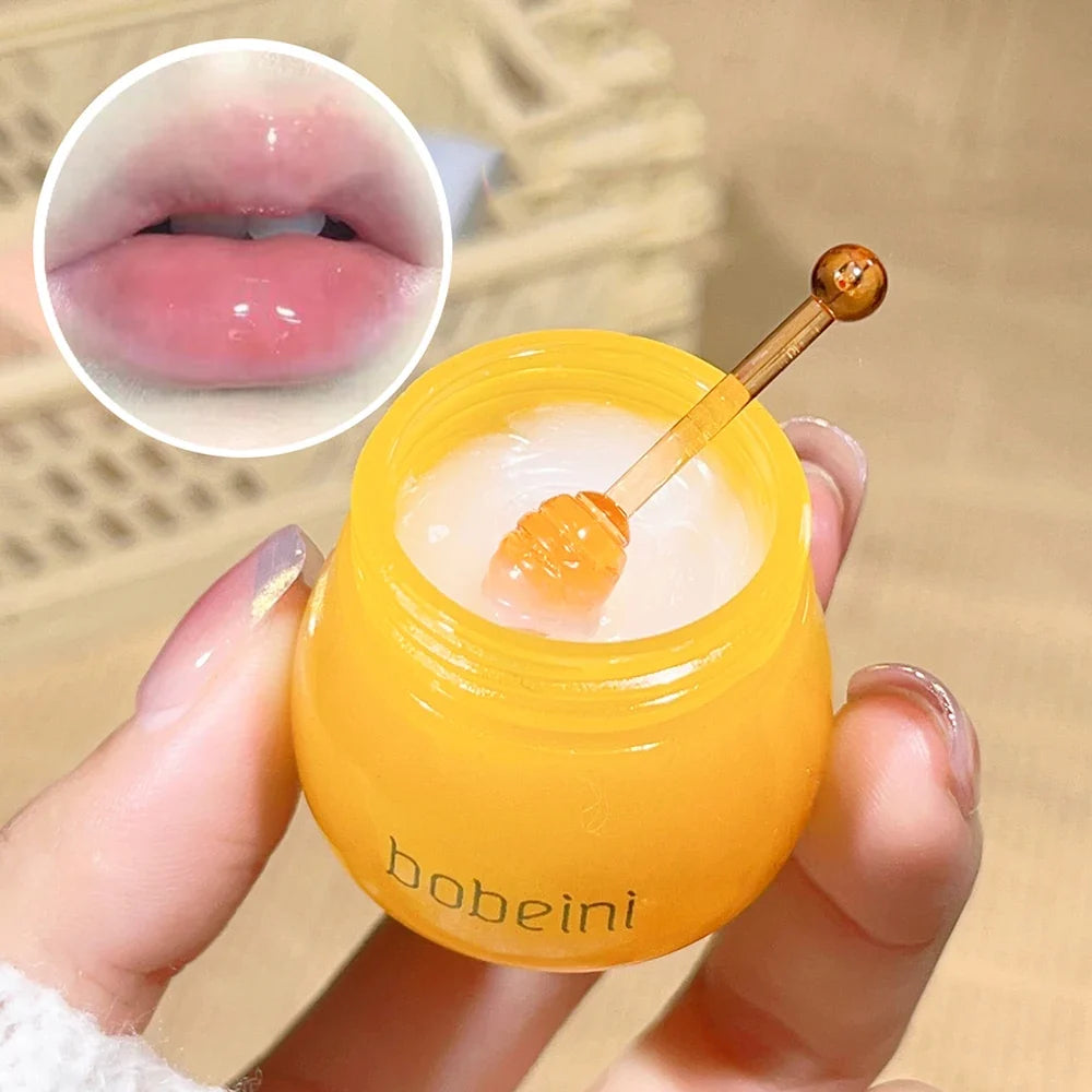Blushimmer Hydrating Peach & Honey Lip Mask showing a jar with peach and honey ingredients, designed to moisturize and soothe lips.