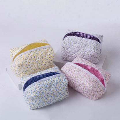 Blushimmer floral quilted makeup bag with puffy design, large travel cosmetic pouch with flower print and multiple compartments.