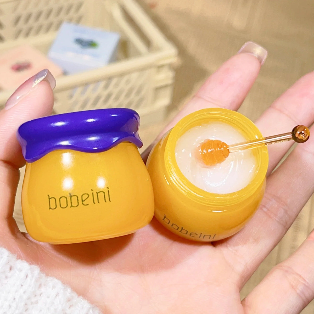 Blushimmer Hydrating Peach & Honey Lip Mask showing a jar with peach and honey ingredients, designed to soothe dry lips and reduce fine lines.