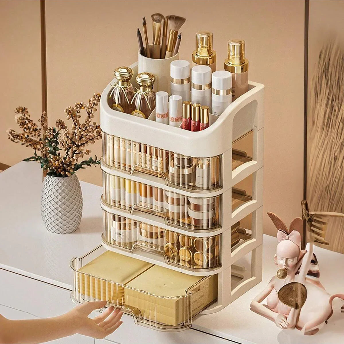 Blushimmer multi-layer makeup storage box with compartments for cosmetics, skincare, eyeshadow, lotions, and lipstick on a dresser or bathroom shelf.