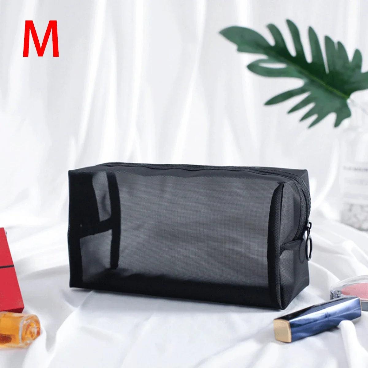 Black mesh cosmetic bag by Blushimmer featuring zipper closure, ideal for travel makeup, toiletries, and portable storage.
