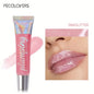 Blushimmer glitter lip gloss tube with moisturizing fruit lip oil for full, soft, and shiny lips.