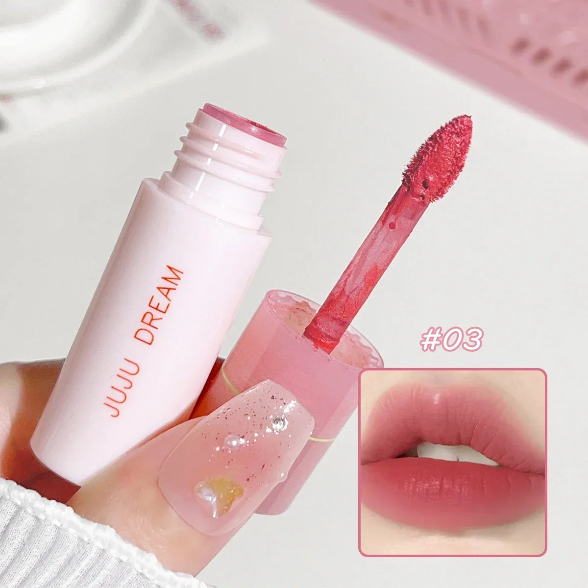 Blushimmer JUJU Dream Small milk tube lip gloss in airy white matte with velvet finish, showcasing its sleek, lifting lip gloss design.