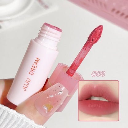 Blushimmer JUJU Dream Small milk tube lip gloss in airy white matte with velvet finish, showcasing its sleek, lifting lip gloss design.