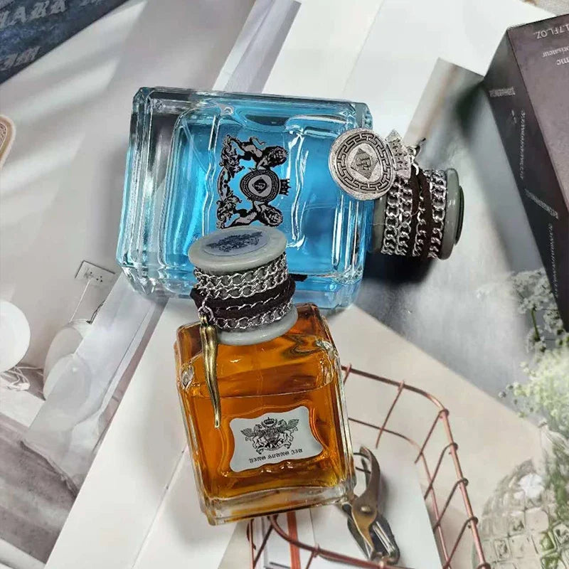 Blushimmer Charm Unleashed cologne bottle featuring woody, citrus, and vitality notes in a sleek men's perfume design.