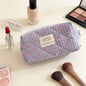 Pink Blushimmer Airfriend makeup bag with cute design, soft fabric, and toiletry organizer for women's travel essentials.