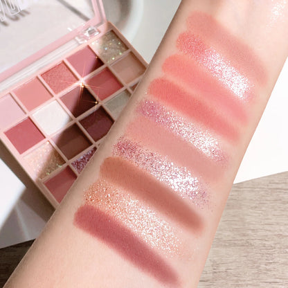 Blushimmer 25-color eye shadow tray with peach and orange shades, sparkling powder, pearl sequins, in a sleek palette.