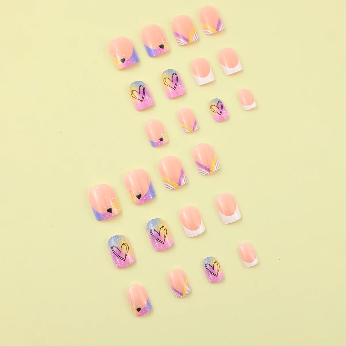 Set of 24 Blushimmer short square fake nails with halo dyed gradient hearts and colorful French tip designs.