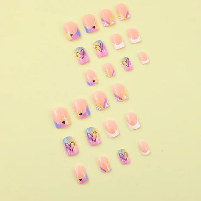 Set of 24 Blushimmer short square fake nails with halo dyed gradient hearts and colorful French tip designs.