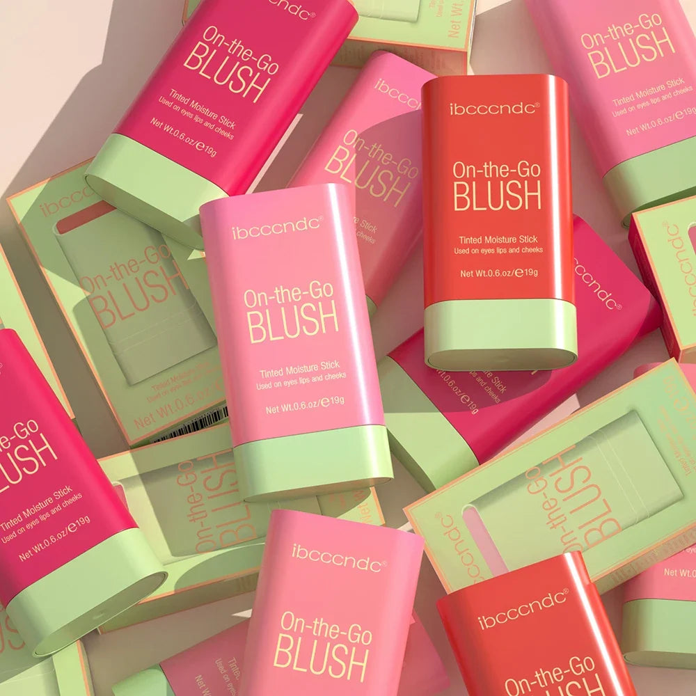 Blushimmer waterproof blush stick with bright coral color, creamy texture, and high color payoff on smooth skin.