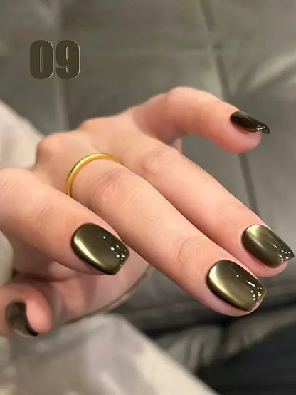 Blushimmer MIANEL 12ml Emperor Green cat eye gel nail polish showing a glossy green nail with a cat eye effect, suitable for salons.