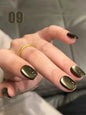 Blushimmer MIANEL 12ml Emperor Green cat eye gel nail polish showing a glossy green nail with a cat eye effect, suitable for salons.