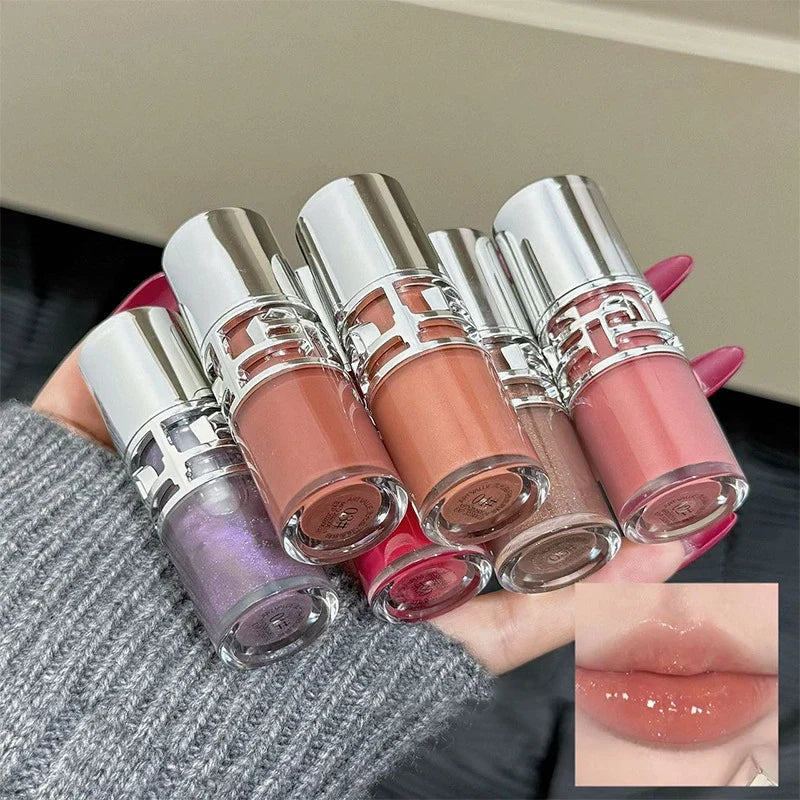 Blushimmer transparent moisturizing lip gloss with a mirror, hydrating and tinted for dry lips, featuring a crystal lip oil finish.