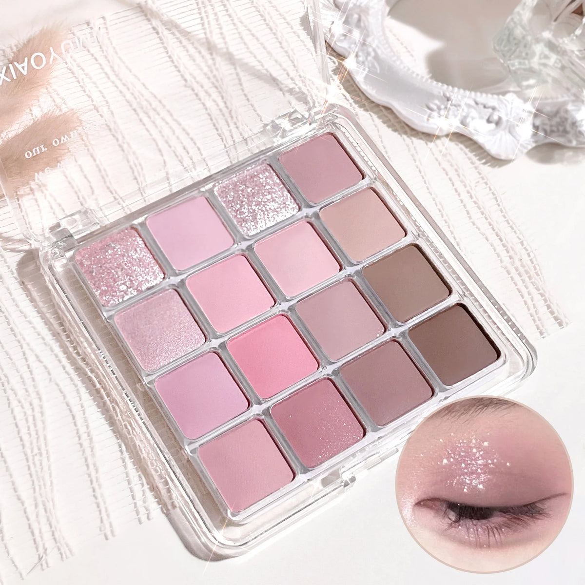 Xiaoyumi 16-color Sunset eyeshadow and highlighter palette by Blushimmer with warm-toned shades and shimmering finishes.