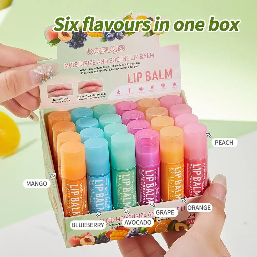 Assorted fruit flavor Blushimmer lip balm set featuring hydrating, nourishing balms in colorful containers for dry lips.