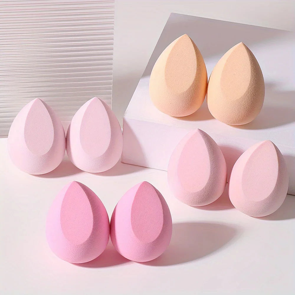 Set of 8 pink Blushimmer makeup sponges, hydrophilic latex-free blenders for foundation, powder, and cream application.