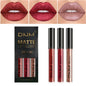 Set of three Blushimmer waterproof liquid lipsticks in red, blue, and purple with matte finish and nude lip tint stain.