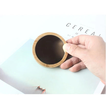 Blushimmer portable round wooden cosmetic mirror, pocket-sized travel compact for beauty and makeup touch-ups.