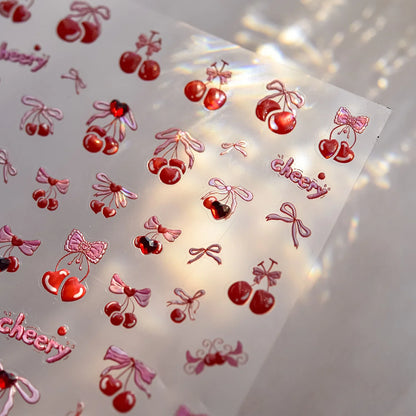Cute cherry-shaped nail art stickers with shiny rhinestones, perfect for DIY manicure decorations by Blushimmer.
