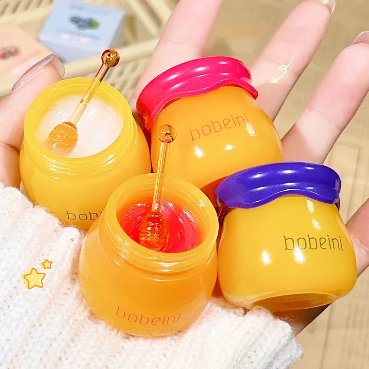 Blushimmer Hydrating Peach & Honey Lip Mask applied on lips, showing smooth, moisturized lips with a hint of peach color and glossy finish.