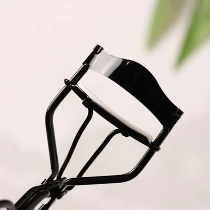 Blushimmer stainless steel eyelash curler and tweezers set with silver and black finish, designed for curling and shaping eyelashes.