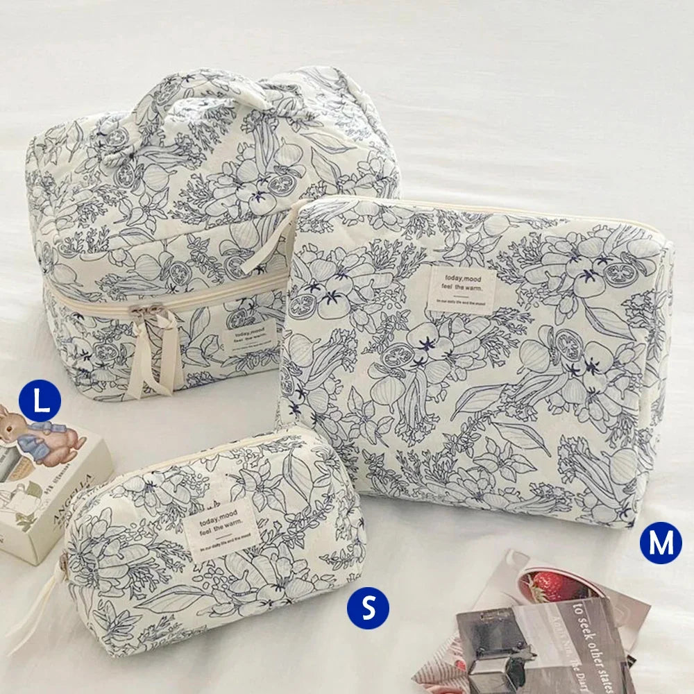 Cute quilted cotton makeup bag by Blushimmer with zipper closure, portable cloth organizer for cosmetics and toiletries.