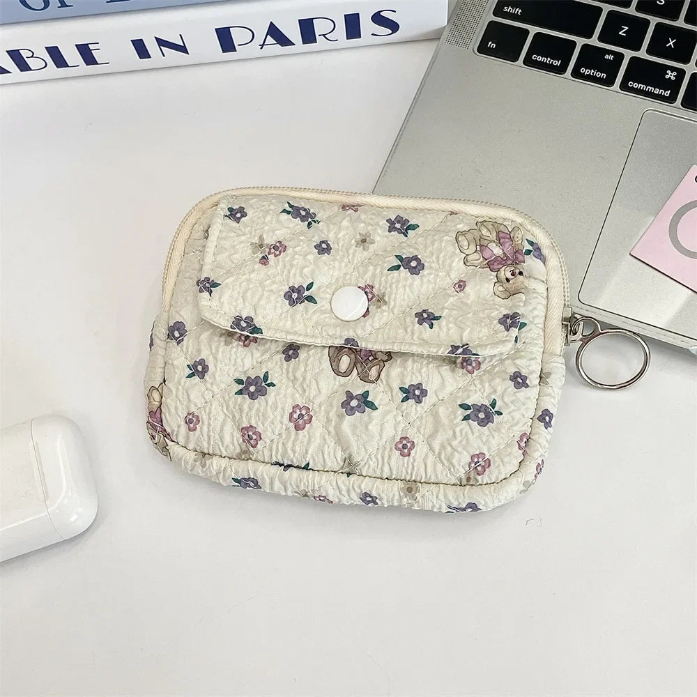 Cute cartoon small travel cosmetic bag by Blushimmer, featuring lipstick, earphone, and card storage in a portable makeup organizer pouch