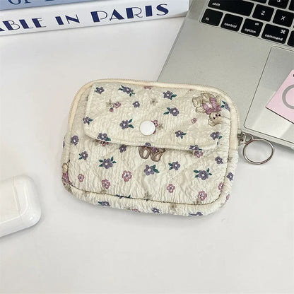 Cute cartoon small travel cosmetic bag by Blushimmer, featuring lipstick, earphone, and card storage in a portable makeup organizer pouch