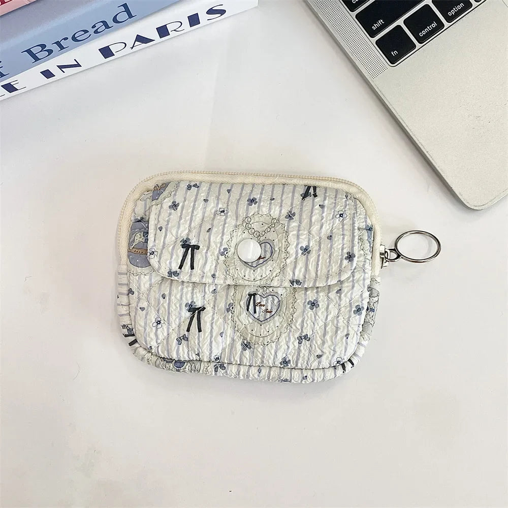 Blushimmer cute cartoon small travel cosmetic bag with lipstick, earphone, and card compartments, perfect for women’s makeup and accessories.