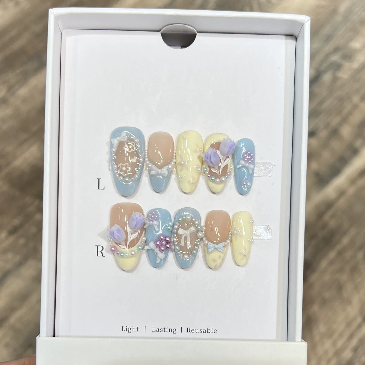 Set of 10 Blushimmer French almond press-on nails with floral design, wearable fake nails for women, easy to apply and remove.