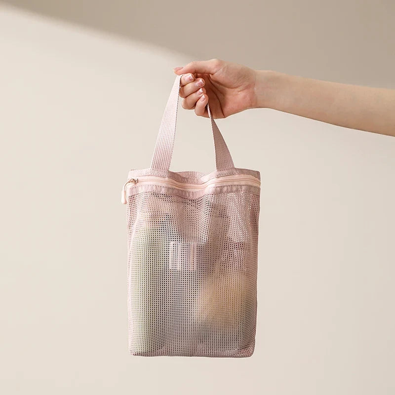 Blushimmer portable toiletry bag with handle, large capacity mesh storage for travel and business trips, perfect for cosmetics and essentials.