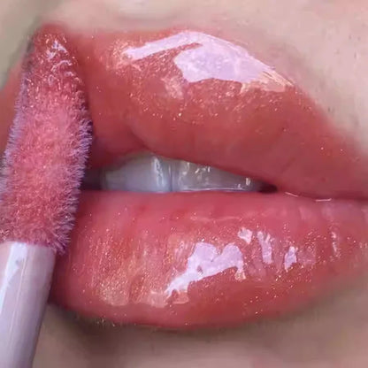 Fenty Beauty Mauve Wive waterproof liquid lip gloss in nude pink with glossy finish, showcasing lips with a smooth tint and shine.
