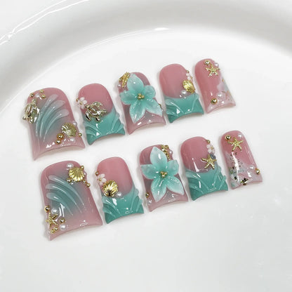 Set of 10 ocean-style fake press-on nails by Blushimmer featuring 3D flowers, pearls, gradient blush, and French tip design.