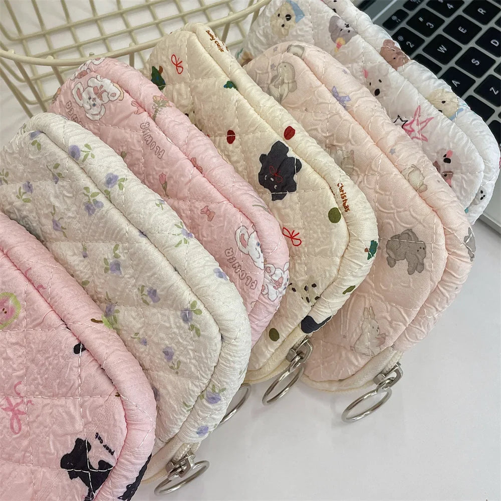 Blushimmer cute cartoon small travel cosmetic bag with lipstick, earphone, and card storage compartments for women.