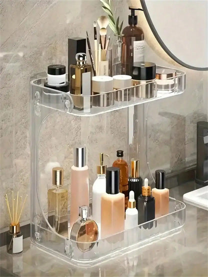 Blushimmer 2-tier transparent plastic desktop cosmetic storage box with wheels and shelves, ideal for organizing beauty products.