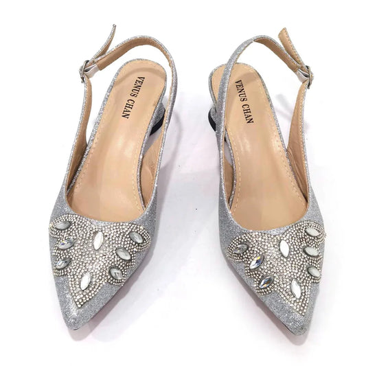 Women's silver mid heels and matching frosted crystal shoes and bag set by EdleessFashion, stylish footwear and accessory combo.