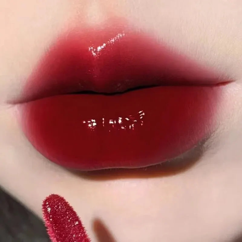 Blushimmer HERORANGE HR567 transparent ice velvet lip glaze and matte lipstick in sleek packaging, showcasing glossy and matte finishes.