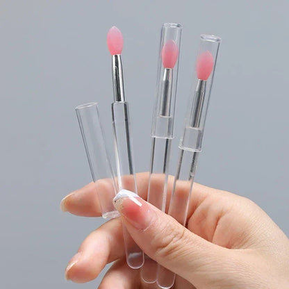 Blushimmer silicone lip and eyeshadow brush with cover, dustproof portable multi-purpose makeup brush with glitter finish.