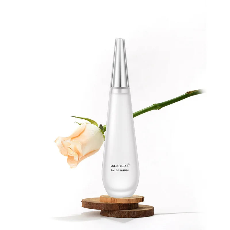 Blushimmer 100ml women's floral eau de parfum bottle with elegant floral design, featuring lotus, rose, peony, amber, and musk notes.