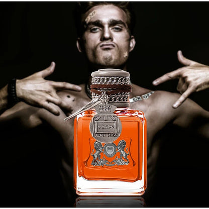 Blushimmer Charm Unleashed Cologne for men with woody, citrus, and vitality notes, featuring a sleek perfume bottle and bold design.