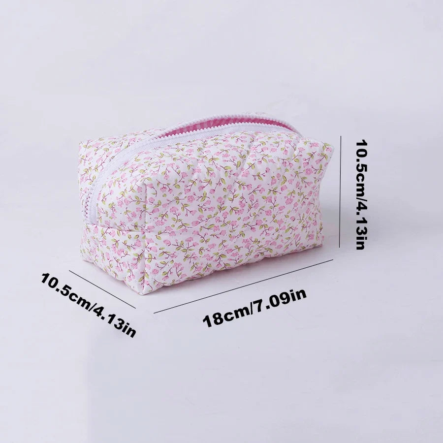 Blushimmer floral quilted makeup bag with puffy design, large travel cosmetic pouch with flower print and multiple compartments.