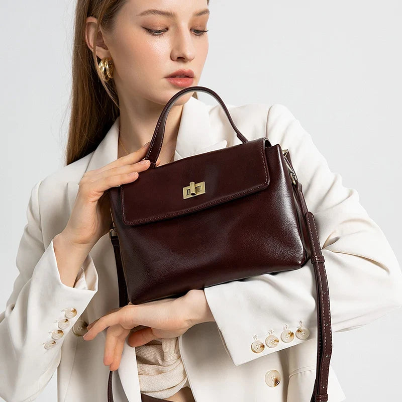 Women's genuine leather crossbody satchel by NNEOBA, featuring a sleek shoulder bag design with a smooth leather finish.