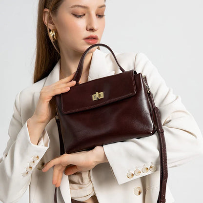 Women's genuine leather crossbody satchel by NNEOBA, featuring a sleek shoulder bag design with a smooth leather finish.