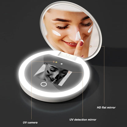 Blushimmer UV mirror sunscreen testing camera with light, 2x magnification, compact pocket size for travel makeup and skin analysis.